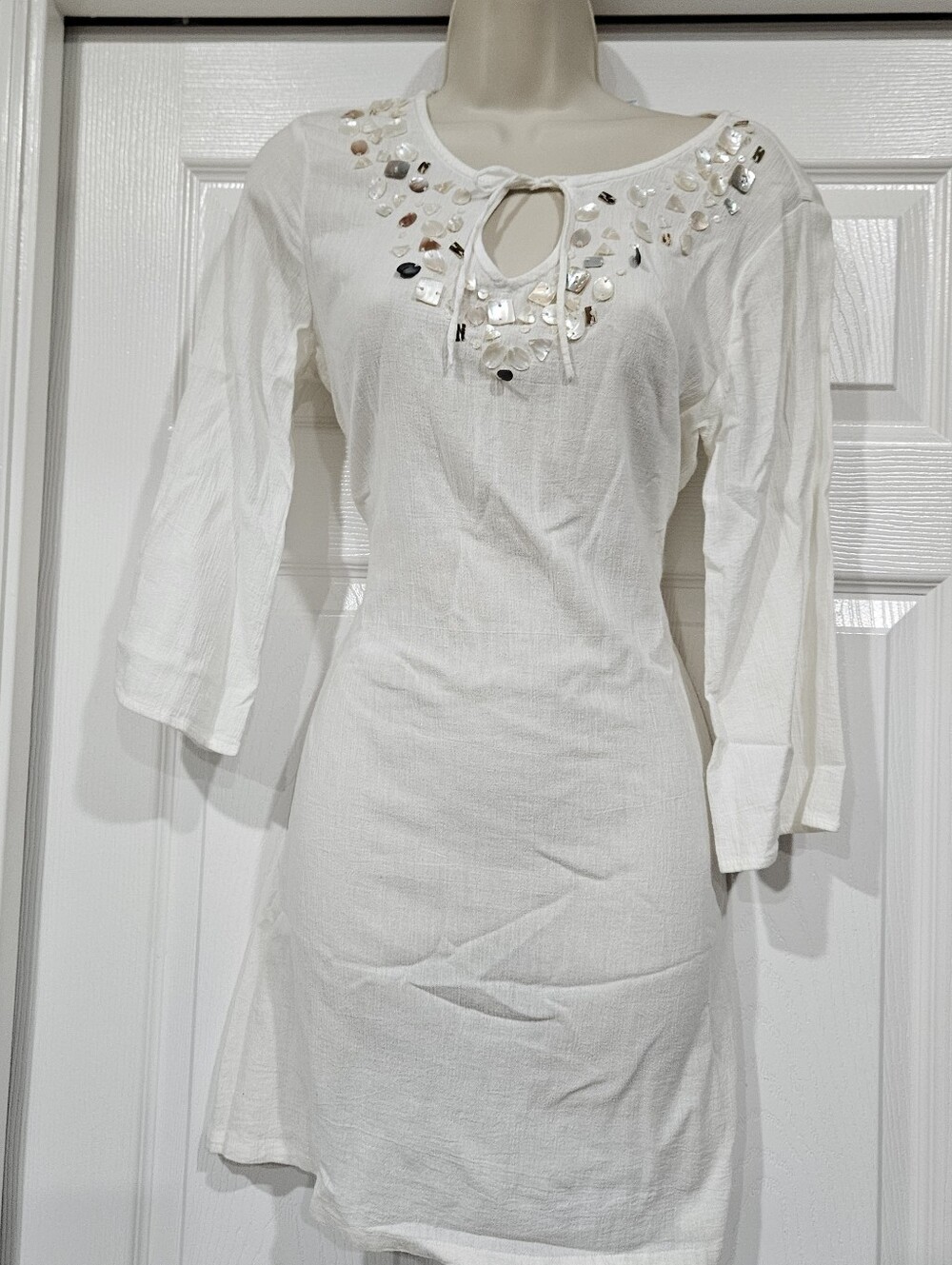 Elegant White Dress with Embellished Neckline